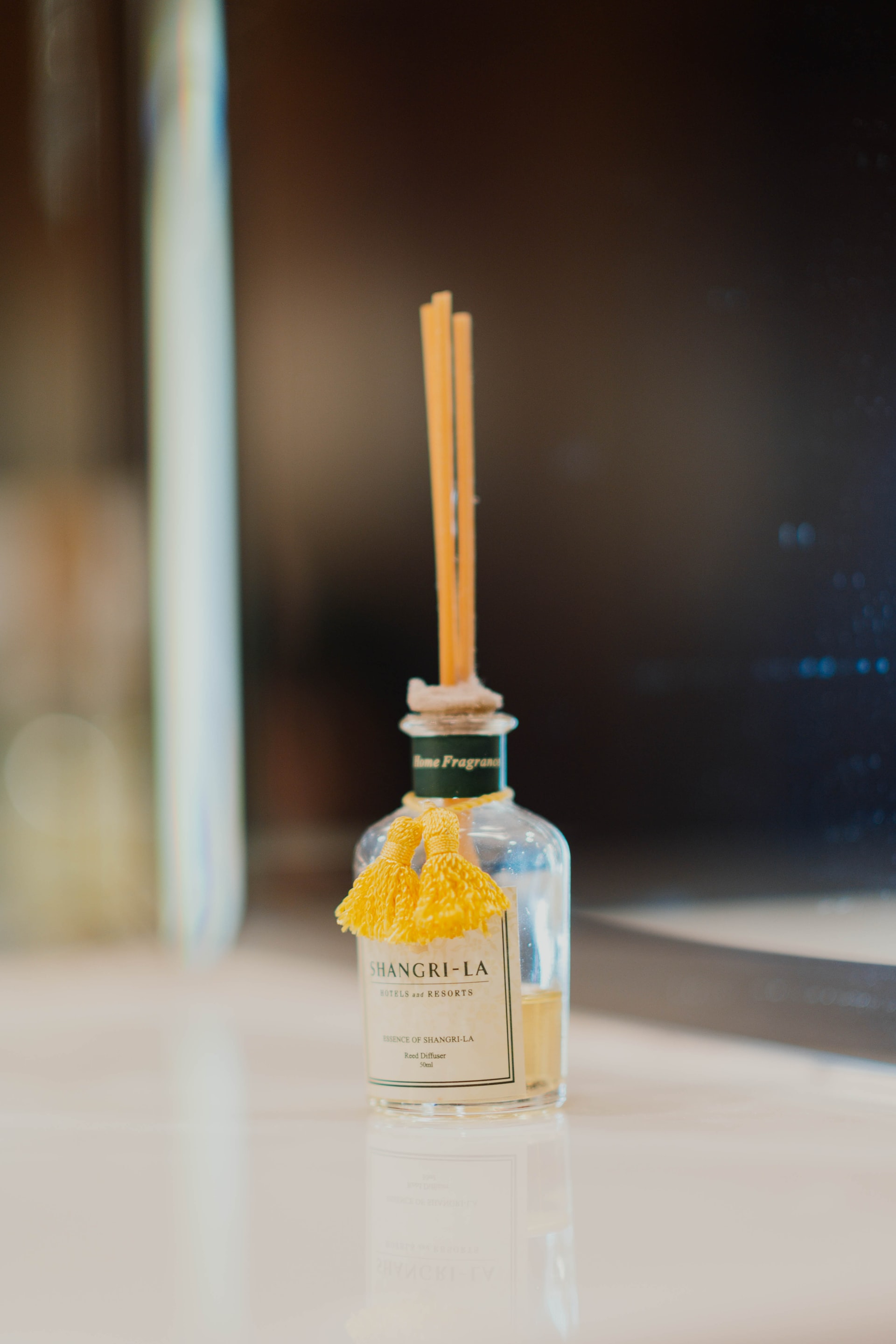 clear glass bottle on white surface